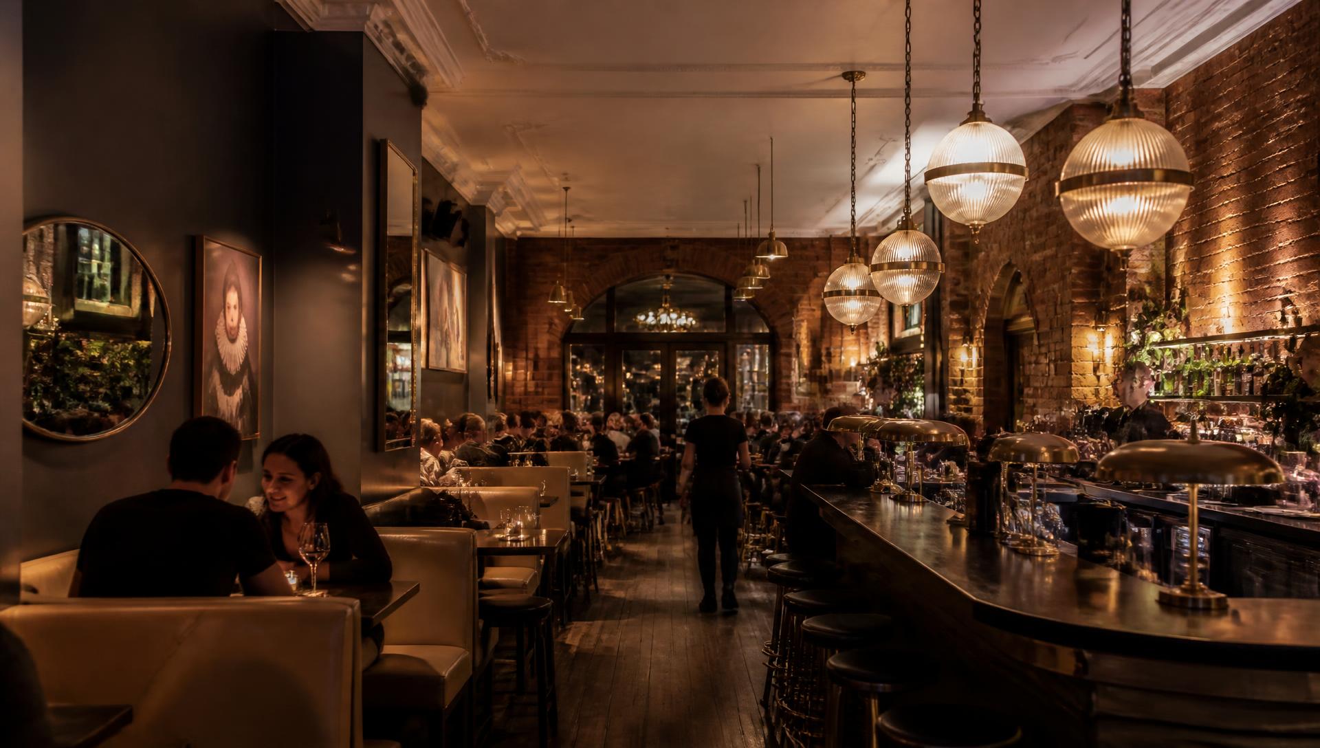 The warm, brick-lined interior of The Reserve Social in Adelaide at night